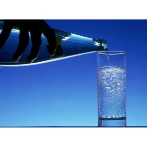 A bottle of sparkling water, showcasing its bubbles and refreshing qualities.